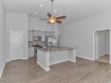 Spacious kitchen with granite island and stainless steel appliances at 4348 Livorn Loop # 4348, Myrtle Beach, SC 29579