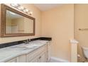 Updated bathroom with granite vanity and decorative mirror at 4910 Windsor Green Way # 303, Myrtle Beach, SC 29579