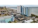 Wide aerial view of resort, beach, ocean, and surrounding buildings at 504 N Ocean Blvd. # 1511, Myrtle Beach, SC 29577