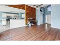 Spacious living room with hardwood floors and a fireplace at 505 White Bark St., Longs, SC 29568