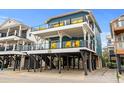 Two-story beach home with ocean views and multiple balconies at 6001 - B-4 S Kings Hwy., Myrtle Beach, SC 29575