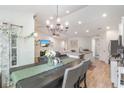 Bright open floorplan with dining area leading into the modern kitchen and living room at 688 Tattlesbury Dr., Conway, SC 29526