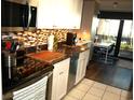 Modern kitchen with granite countertops and stainless steel appliances at 6900 N Ocean Blvd. # 111, Myrtle Beach, SC 29572