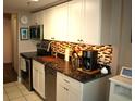 Modern kitchen with granite countertops and stainless steel appliances at 6900 N Ocean Blvd. # 111, Myrtle Beach, SC 29572