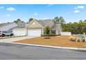 Two-story house with attached garage and landscaping at 763 Eastridge Dr., Conway, SC 29526