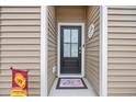 Front door entry with a welcome mat and house number at 763 Eastridge Dr., Conway, SC 29526