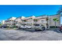 Ocean Bridge building exterior with parking lot at 9661 Shore Dr. # 4B-15, Myrtle Beach, SC 29572