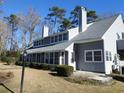 Side view of gray house with landscaping at 1210 Benna Dr. # B, Myrtle Beach, SC 29577