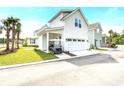 Attached garage with golf cart and additional parking at 1623 Sayebrook Pkwy., Myrtle Beach, SC 29588