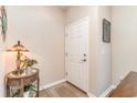 Inviting entryway with a white door and side table at 173 Olde Towne Way # 3, Myrtle Beach, SC 29588