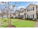 Townhome community with manicured lawns and mature trees at 173 Olde Towne Way # 3, Myrtle Beach, SC 29588