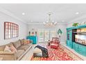 Bright living room with comfortable seating, a large TV, and access to a balcony at 212 4Th Ave. N # 102, North Myrtle Beach, SC 29582