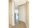 Hallway with tan walls and a door and closet for storage at 2504 N Ocean Blvd. # 832, Myrtle Beach, SC 29577