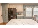 Modern kitchen with stainless steel appliances and white cabinets at 3040 Thoroughfare Dr., Conway, SC 29526