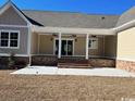 Covered back porch with brick steps and ceiling fans at 3220 Highway 19, Conway, SC 29526