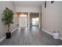 Bright entryway with gray flooring and a view to the dining room at 3562 Battery Way Ct., Myrtle Beach, SC 29579