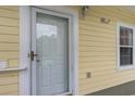 Exterior condo entry door with glass panel and number 201 at 4271 Hibiscus Dr. # 201, Little River, SC 29566