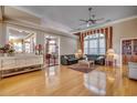 Spacious living room with hardwood floors, a large window, and comfortable seating at 4280 Doral Pl., Myrtle Beach, SC 29579