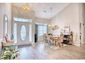 Spacious dining room with hardwood floors, large windows, and seating for six at 520 Hobie Cat Rd., Myrtle Beach, SC 29588