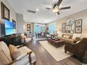 Open concept living space with hardwood floors, a dining area, and comfortable seating at 5220 Sea Coral Way, North Myrtle Beach, SC 29582