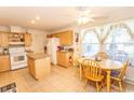 Kitchen with island, light wood cabinets, and a breakfast nook at 567 Woodholme Dr., Conway, SC 29526