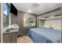 Main bedroom with a queen bed, TV, and mirrored closet at 6001 - 8047 S Kings Hwy., Myrtle Beach, SC 29575
