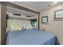 Comfortable bedroom with a queen bed and coastal decor at 6001 - 8047 S Kings Hwy., Myrtle Beach, SC 29575