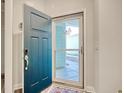 Inviting entryway with a stylish dark teal front door and storm door at 6070 Tramonto St., Myrtle Beach, SC 29577