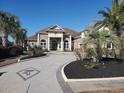 Two-story house with circular driveway and palm trees at 8010 Wacobee Dr., Myrtle Beach, SC 29579