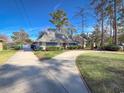 Gray home with circular driveway and landscaping at 804 47Th Ave. N, Myrtle Beach, SC 29577