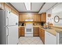 Well-equipped kitchen with ample storage and white appliances at 9570 Shore Dr. # 211, Myrtle Beach, SC 29572