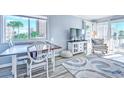 Dining area and living room with ocean view, light and airy at 9571 Shore Dr. # 119, Myrtle Beach, SC 29572