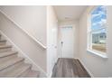 Bright entryway with stairs, storage closet, and a view to the backyard at 1106 Black Lake Way, Conway, SC 29526