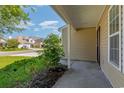 Covered front porch with view of neighborhood and landscaping at 1247 Brighton Ave., Myrtle Beach, SC 29588