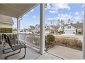 Relaxing front porch with white columns and seating at 1401 Suncrest Dr., Myrtle Beach, SC 29579