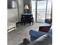 Living room with ocean view, featuring a sofa and dining table at 161 Seawatch Dr. # 1108, Myrtle Beach, SC 29572