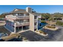 Elevated view of condo building showcasing balcony and parking at 1801 N Ocean Blvd. # K1, North Myrtle Beach, SC 29582