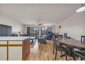 Open living room with hardwood floors, kitchen island, and dining area at 1881 Colony Dr. # 7D, Surfside Beach, SC 29575