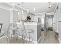 Modern kitchen with stainless steel appliances and breakfast bar at 2500 N Ocean Blvd. # Ph1, Myrtle Beach, SC 29577