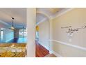 Inviting hallway with archways, wood floors, and elegant decor leading to the living area at 257 Venice Way # H 204, Myrtle Beach, SC 29577