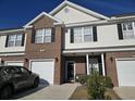 Townhome exterior with brick and vinyl siding, 2-car garage at 270 Connemara Dr. # C, Myrtle Beach, SC 29579