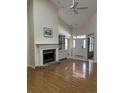 Bright living room with hardwood floors, fireplace, and vaulted ceiling at 35 Dornoch Dr., Pawleys Island, SC 29585