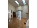 Bright, open living room with hardwood floors, fireplace, and French doors at 35 Dornoch Dr., Pawleys Island, SC 29585