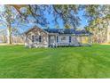 House exterior showcasing a large yard and front porch at 3703 Green Sea Rd., Green Sea, SC 29545