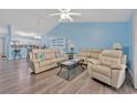 Relaxing living room with vaulted ceilings, recessed lighting, and comfortable seating at 4850 Meadowsweet Dr. # 1711, Myrtle Beach, SC 29579