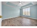 Spacious bedroom with light blue walls and wood-look flooring at 503 Waltham Forest Dr. # 1004, Murrells Inlet, SC 29576