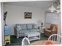 Living room features sofa, chairs, and coffee table at 5905 S Kings Highway # 2106-C, Myrtle Beach, SC 29575