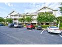 Three-story building with parking and landscaping at 6203 Catalina Dr. # 1814, North Myrtle Beach, SC 29582