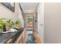 View of entryway with hardwood floors, access to backyard, and coat rack at 629 Riverward Dr. # 629, Myrtle Beach, SC 29588