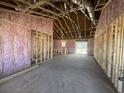 Spacious living room featuring unfinished walls, bare concrete floors and an open concept design at 8183 Kerl Rd., Conway, SC 29526
